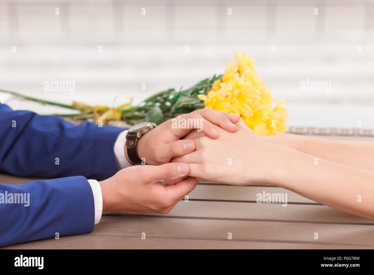 Close-up of man holding woman hand Stock Photo