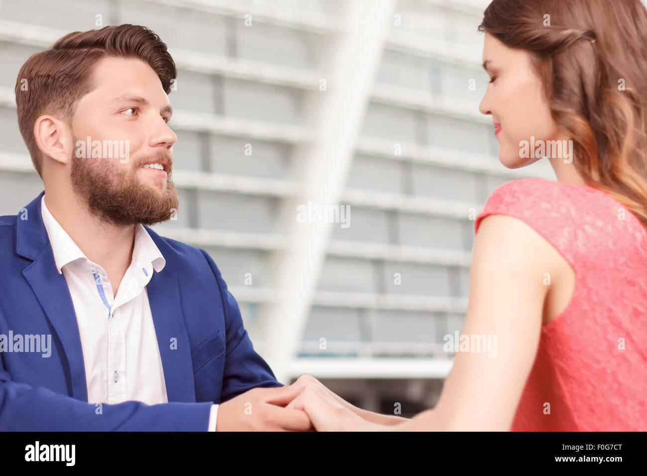 Man holding hands of his smiling girlfriend Stock Photo