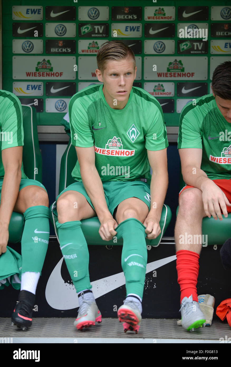 Bremen, Germany. 15th Aug, 2015. Werder's new striker Aron Johannsson sits on the bench prior to the German Bundesliga soccer match between SV Werder Bremen and FC Schalke 04 at Weserstadion in Bremen, Germany, 15 August 2015. Photo: CARMEN JASPERSEN/dpa (EMBARGO CONDITIONS - ATTENTION: Due to the accreditation guidelines, the DFL only permits the publication and utilisation of up to 15 pictures per match on the internet and in online media during the match.)/dpa/Alamy Live News Stock Photo