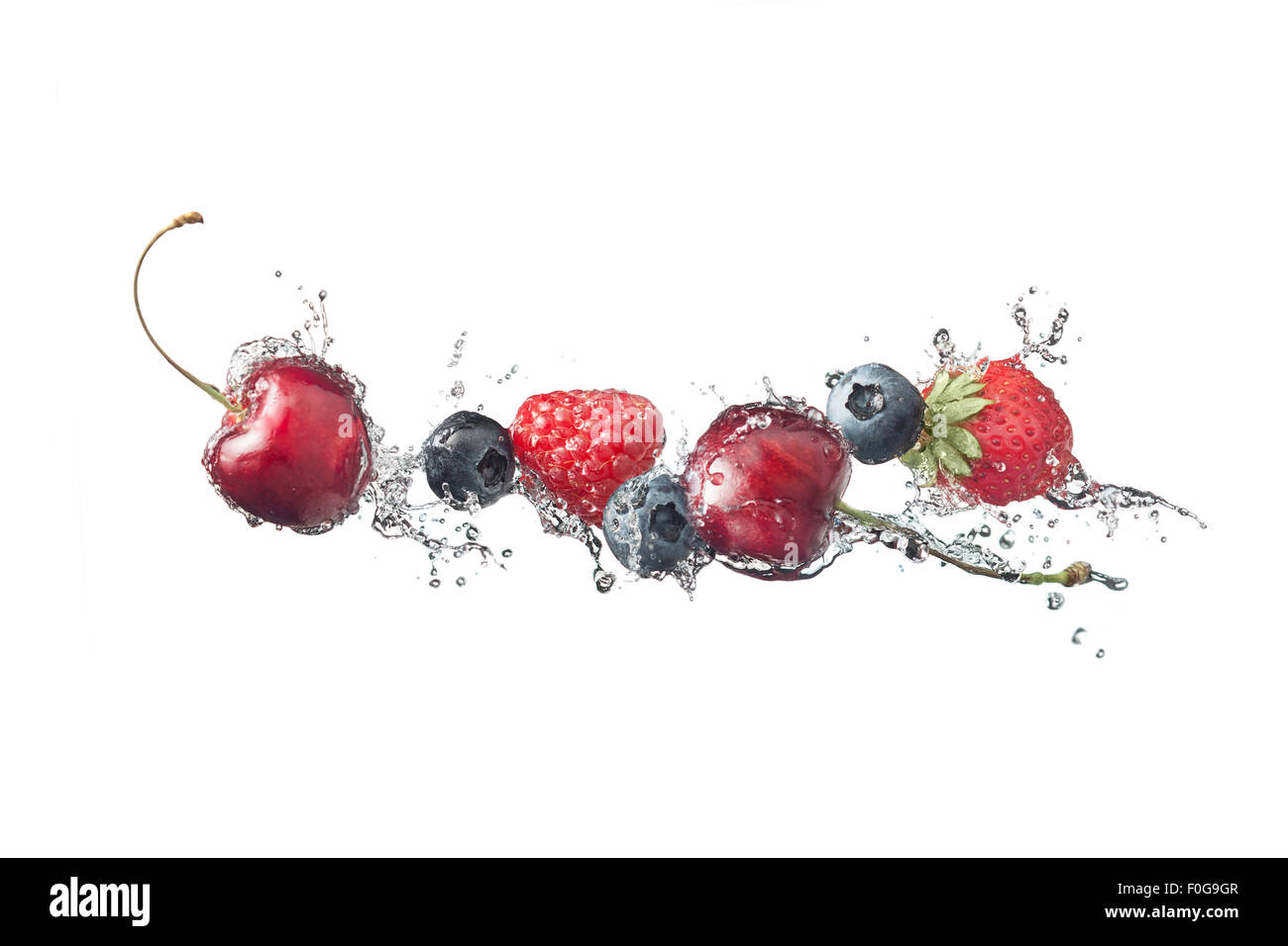 Berries with water splashes isolated on white background Stock Photo