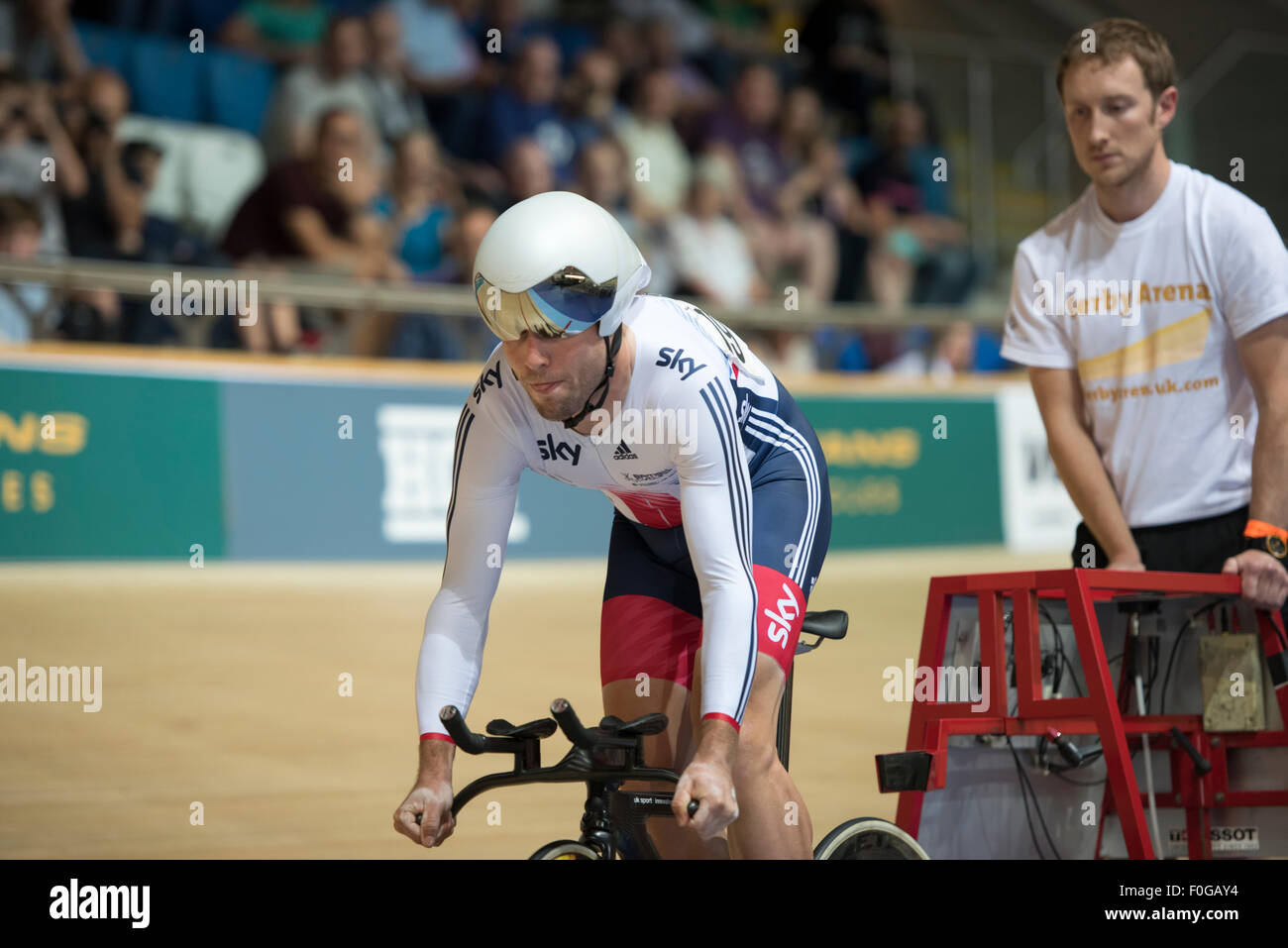 Derby, UK. 15th Aug, 2015. Mark Cavendish leaves the start gate in the individual pursuit during the men's omnium competition at the Revolution Series at Derby Arena, Derby, United Kingdom on 15 August 2015. The Revolution Series is a professional track racing series featuring many of the world's best track cyclists. This event, taking place over 3 days from 14-16 August 2015, is an important preparation event for the Rio 2016 Olympic Games, allowing British riders to score qualifying points for the Games. Credit:  Andrew Peat/Alamy Live News Stock Photo