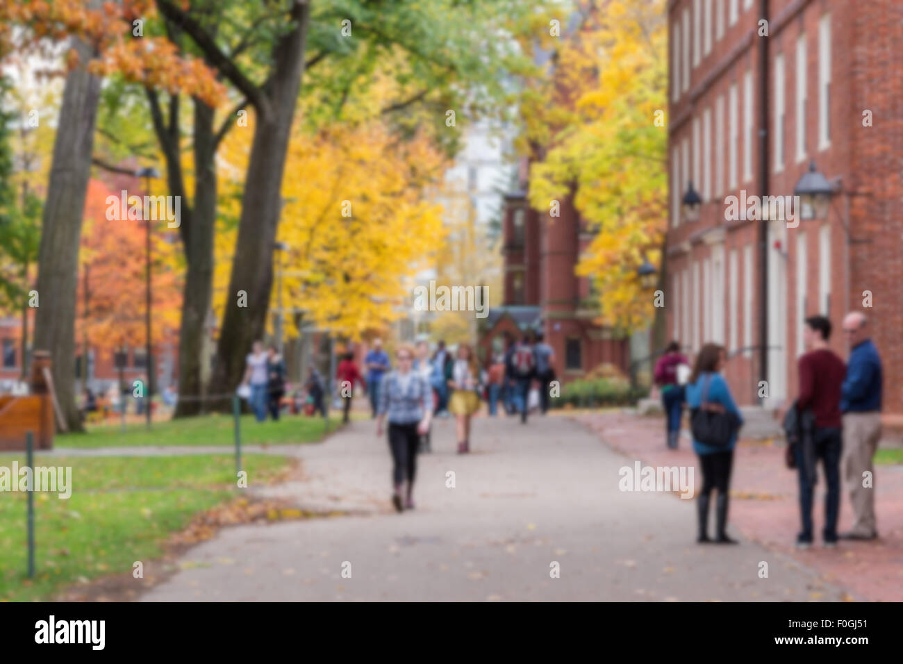 Blurred background of Harvard Yard, old heart of Harvard University campus, on a beautiful Fall day. Stock Photo