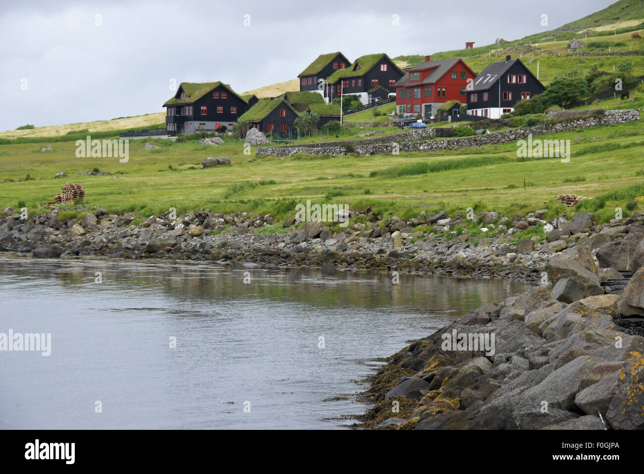 Turf-roofed homes in village of Kirkjubour, Stremoy, Faroe Islands Stock Photo