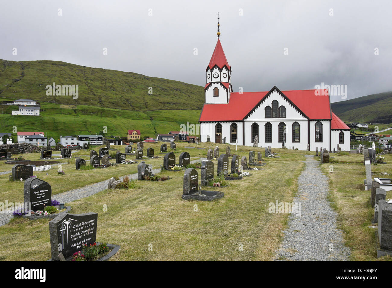 Church and cemetery in village of Sandavagur, Vagar Island, Faroe Islands Stock Photo