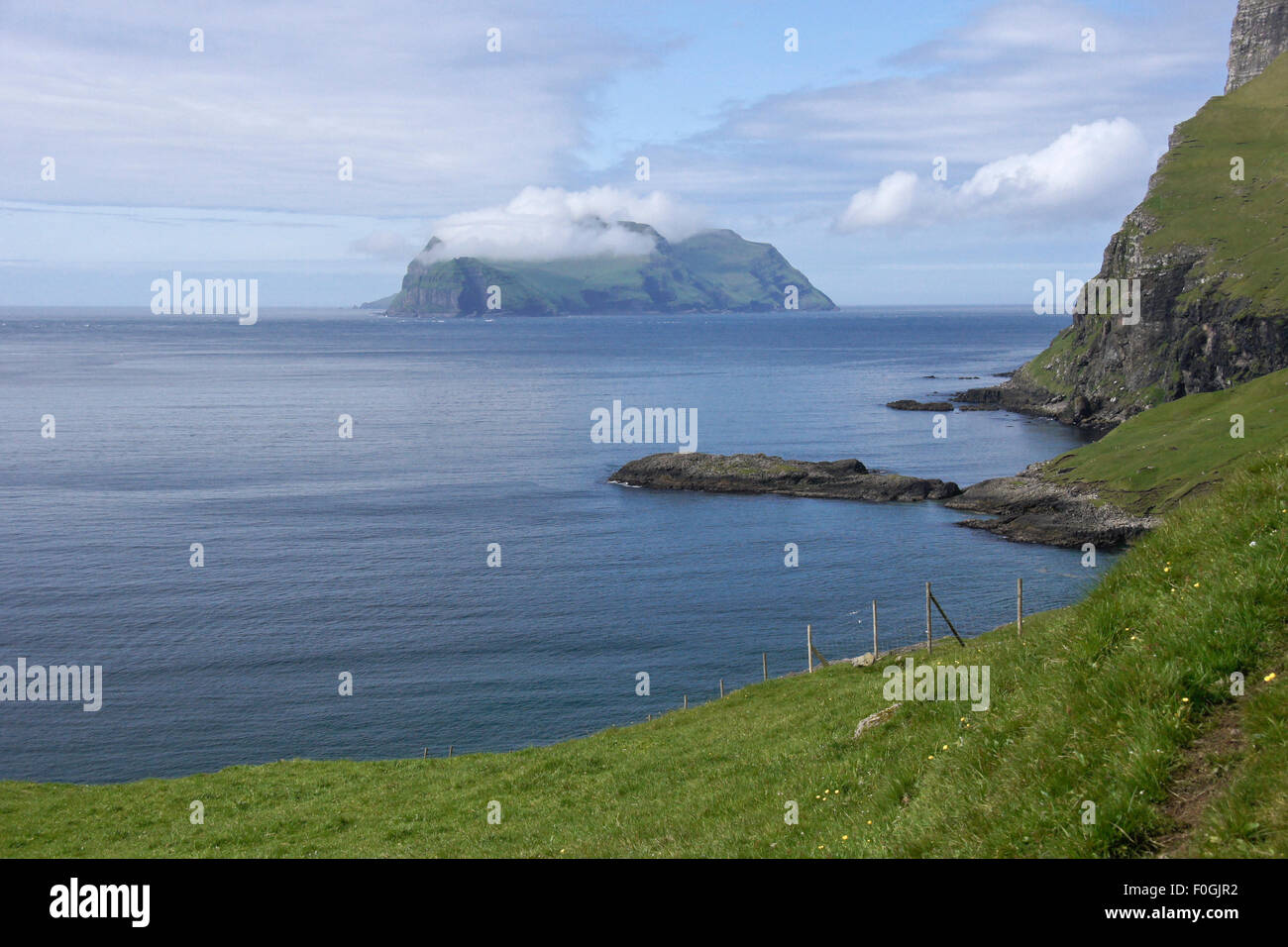 Cloud on top of Mykines Island, Faroe Islands Stock Photo