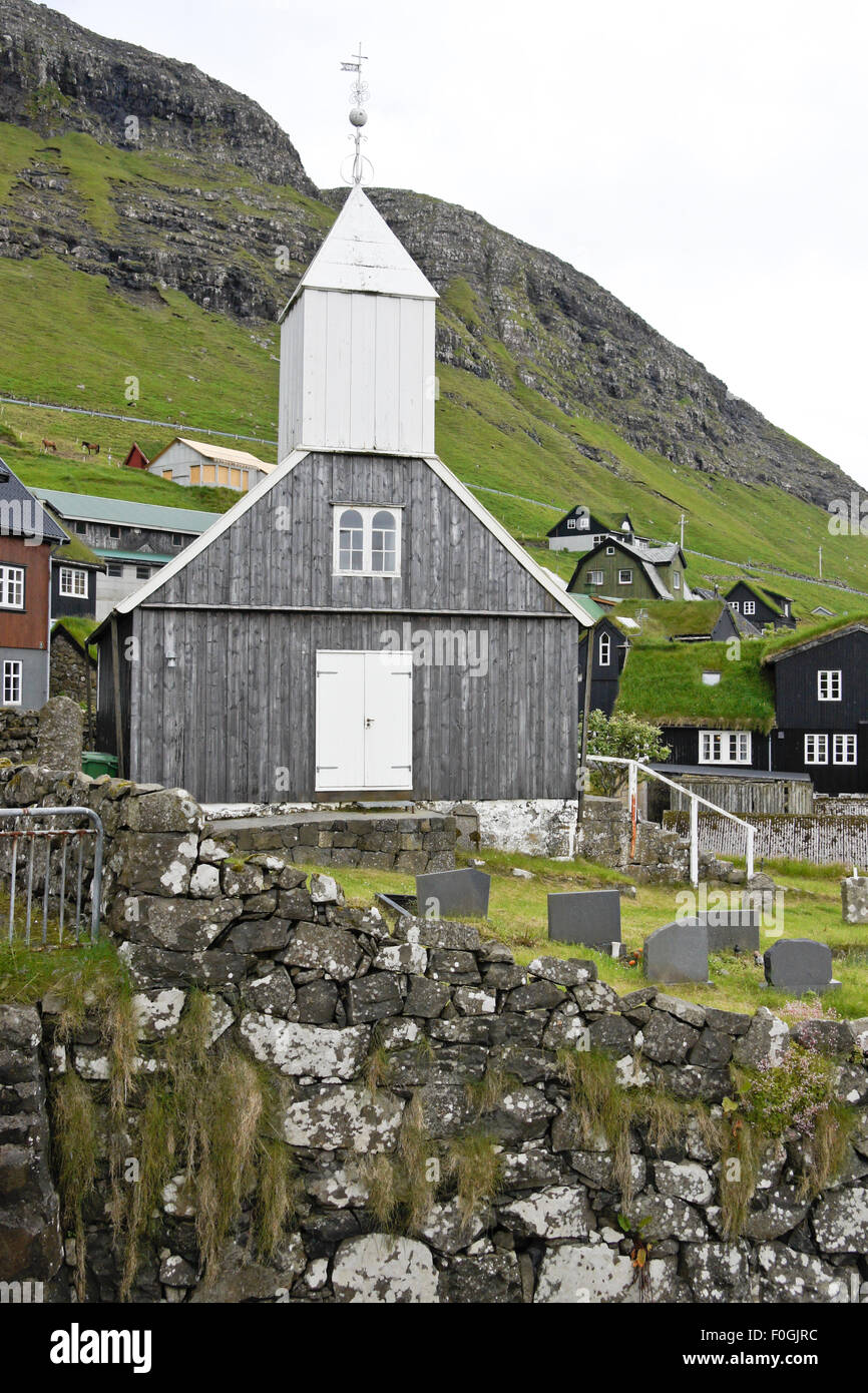 Church and graveyard in village of Bour, Vagar Island, Faroe Islands Stock Photo
