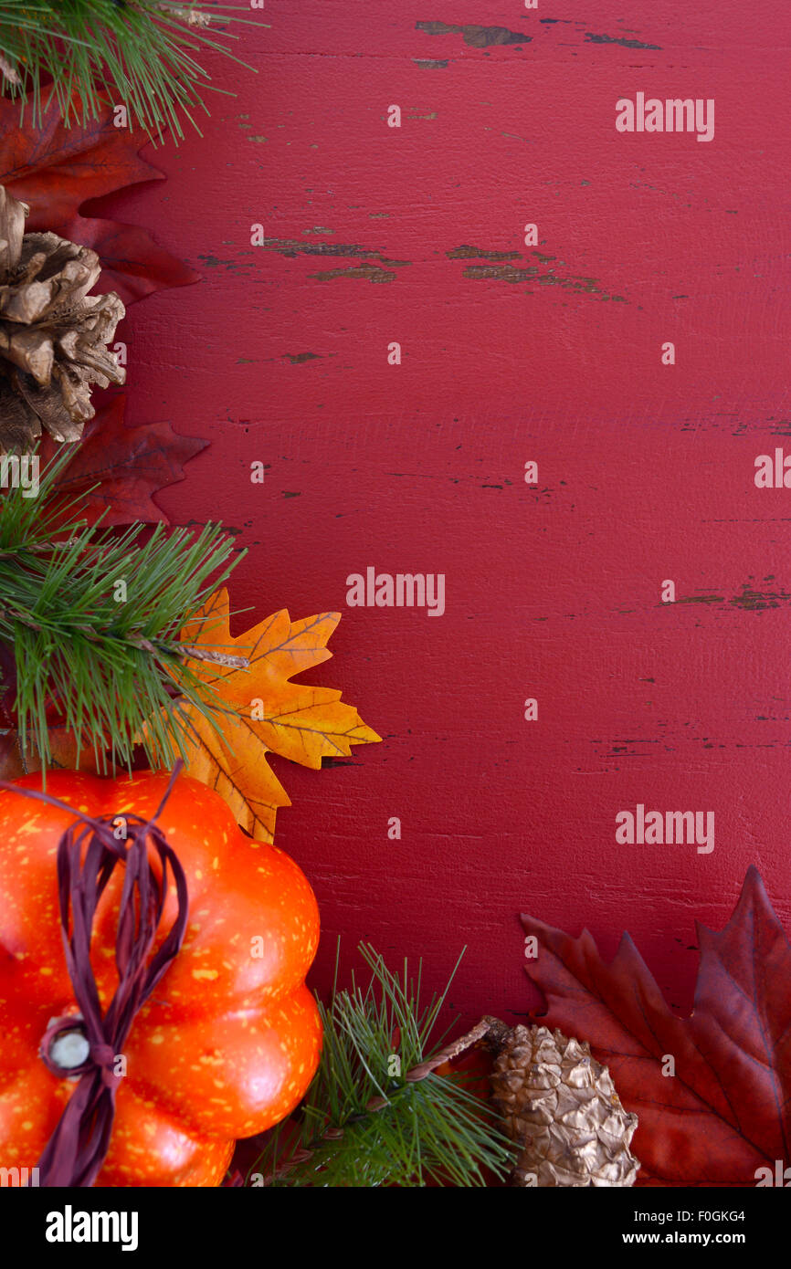 Autumn Fall background for Thanksgiving or Halloween with leaves and decorations on rustic wood table with copy space for your t Stock Photo