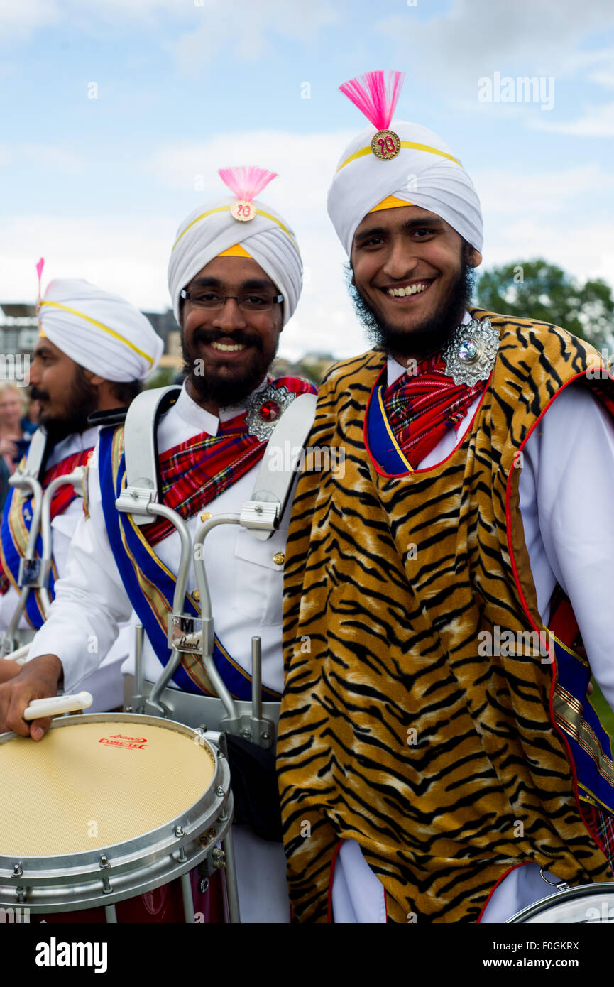 Glasgow, Scotland, UK, 15th August, 2015. The World Pipe Band Championships held in Glasgow Green brings pipe bands from all over the world come to compete through the various grades. Approximately 8000 musicians from all over the world. Drummers form the The Sri Dasmesh Malaysian Sikh Pipe band. The first time the band has competed here in Glasgow. Credit:  Andrew Steven Graham/Alamy Live News Stock Photo