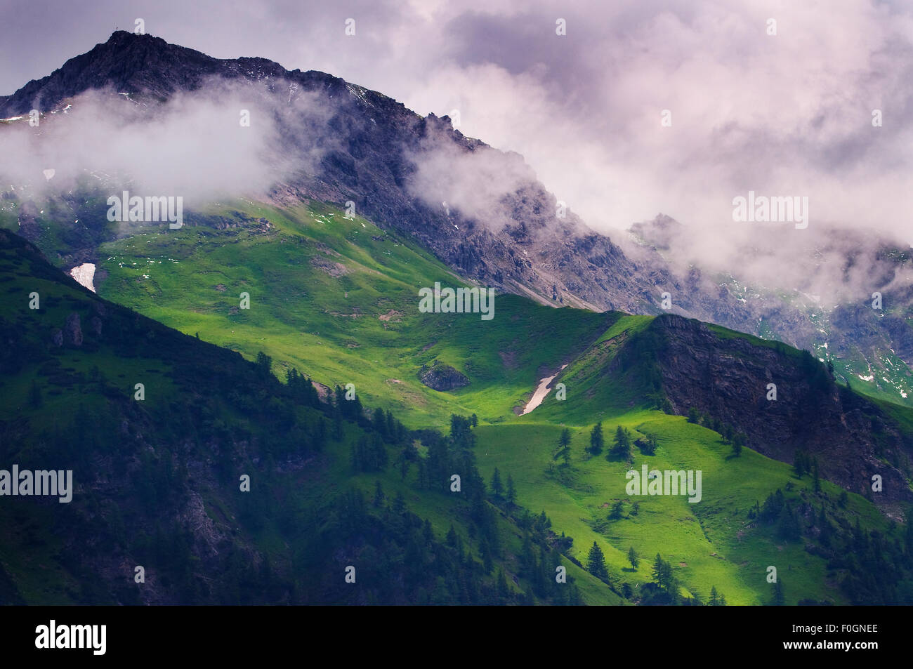 Clouds surrounding mountains near Steg, Liechtenstein, June 2009 Stock Photo