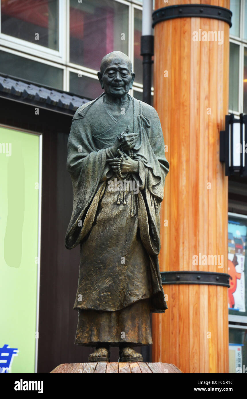 Gyoki Bosatsu statue of a monk stands in front of a small fountain near the kintetsu Nara station in Nara, Japan. Stock Photo