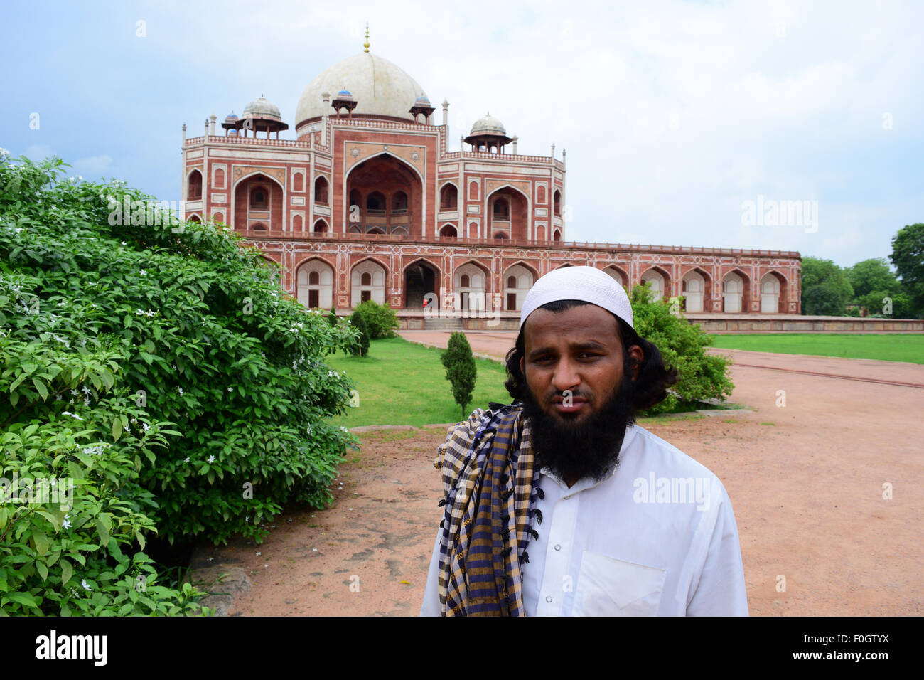 Muslim Man in Traditional Islamic Dressing India in front of Humayun's Tomb Monument Delhi Stock Photo
