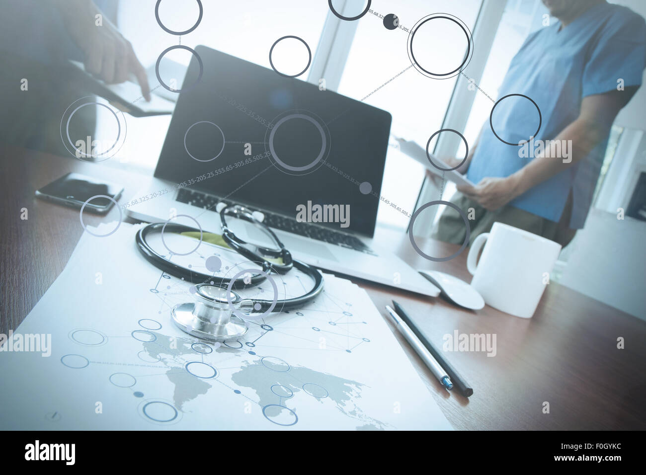team doctor working with laptop computer in medical workspace office ...