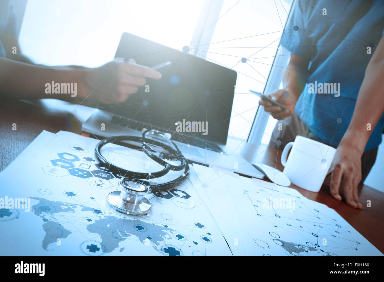 team doctor working with laptop computer in medical workspace office ...