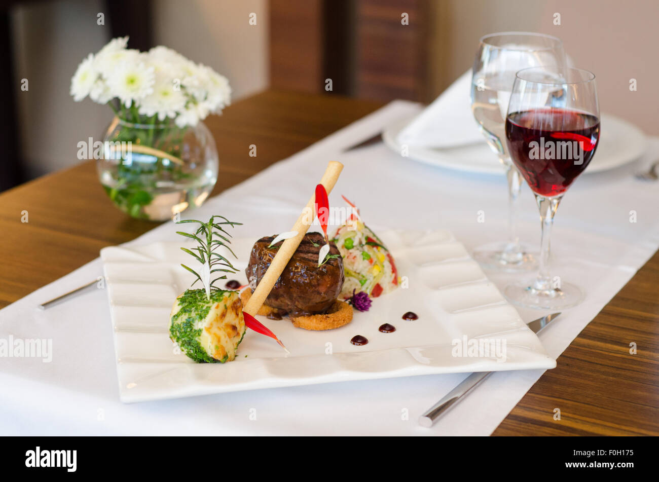 Dining table with steak and wine Stock Photo Alamy