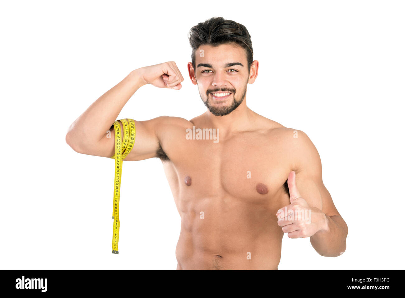 Image of muscular man measure his waist with measuring tape in centimeters  Stock Photo - Alamy