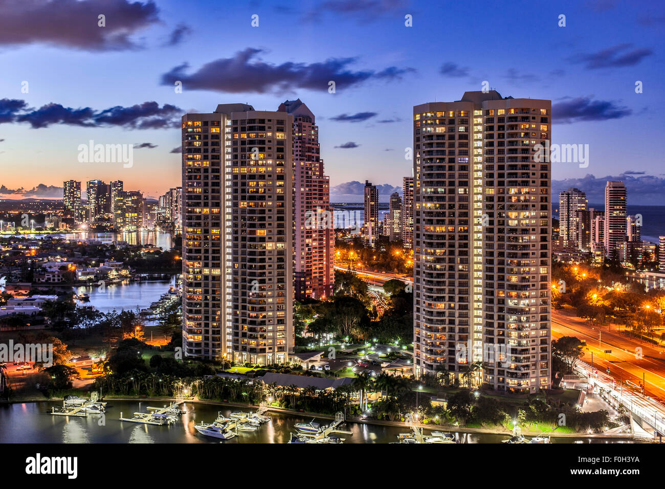 Night landscape showing high rise buildings next to the beach and ocean on the Gold Coast in Queensland Australia Stock Photo