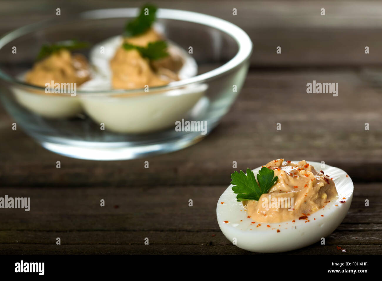 Stuffed eggs with chicken pate, red pepper and chilli Stock Photo