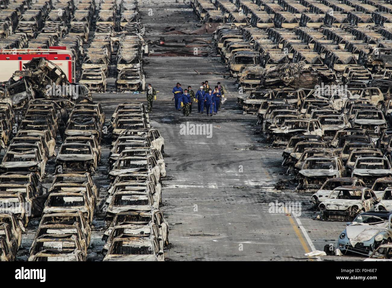 (150816) -- TIANJIN, Aug. 16, 2015 (Xinhua) -- Rescuers work at the explosion site in north China's Tianjin Municipality, Aug. 16, 2015. A total of 112 bodies have been found, and 95 people remained missing, including 85 firefighters, after massive warehouse explosions rocked north China's Tianjin city Wednesday night, officials said at a press conference Sunday morning. (Xinhua/Zheng Huansong) (dhf) Stock Photo