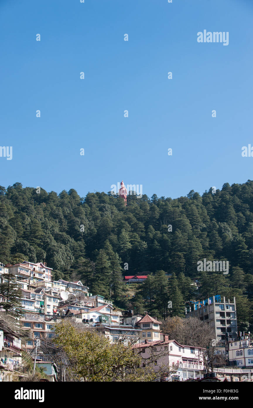 Shimla, Himachal Pradesh, India. Looking eastwards over the town with the Hanuman statue in the distance. Stock Photo