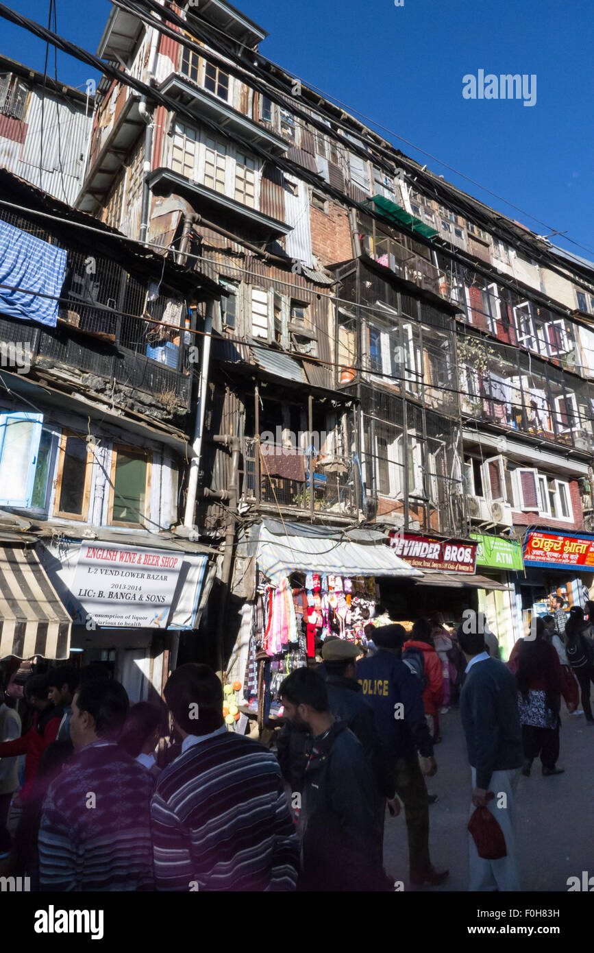 Shimla, Himachal Pradesh, India. Densely populated ramshackle town centre buildings with shops at street level and residential accommodation above on Lower Bazaar. Stock Photo