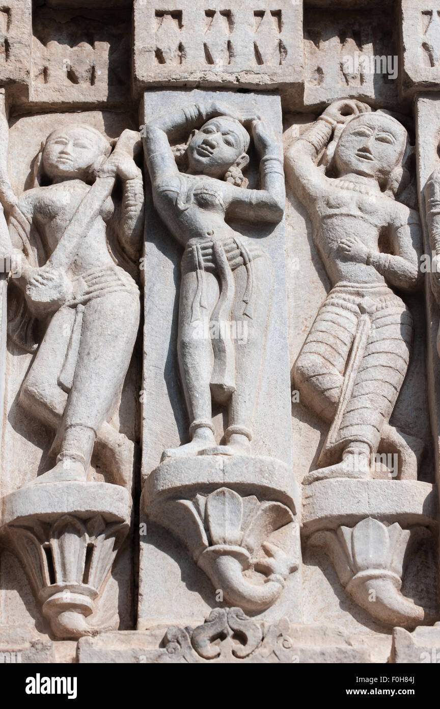 Udaipur, India. 17th century Jagdish Temple, details carved on outside wall, women musicians and dancers. Stock Photo