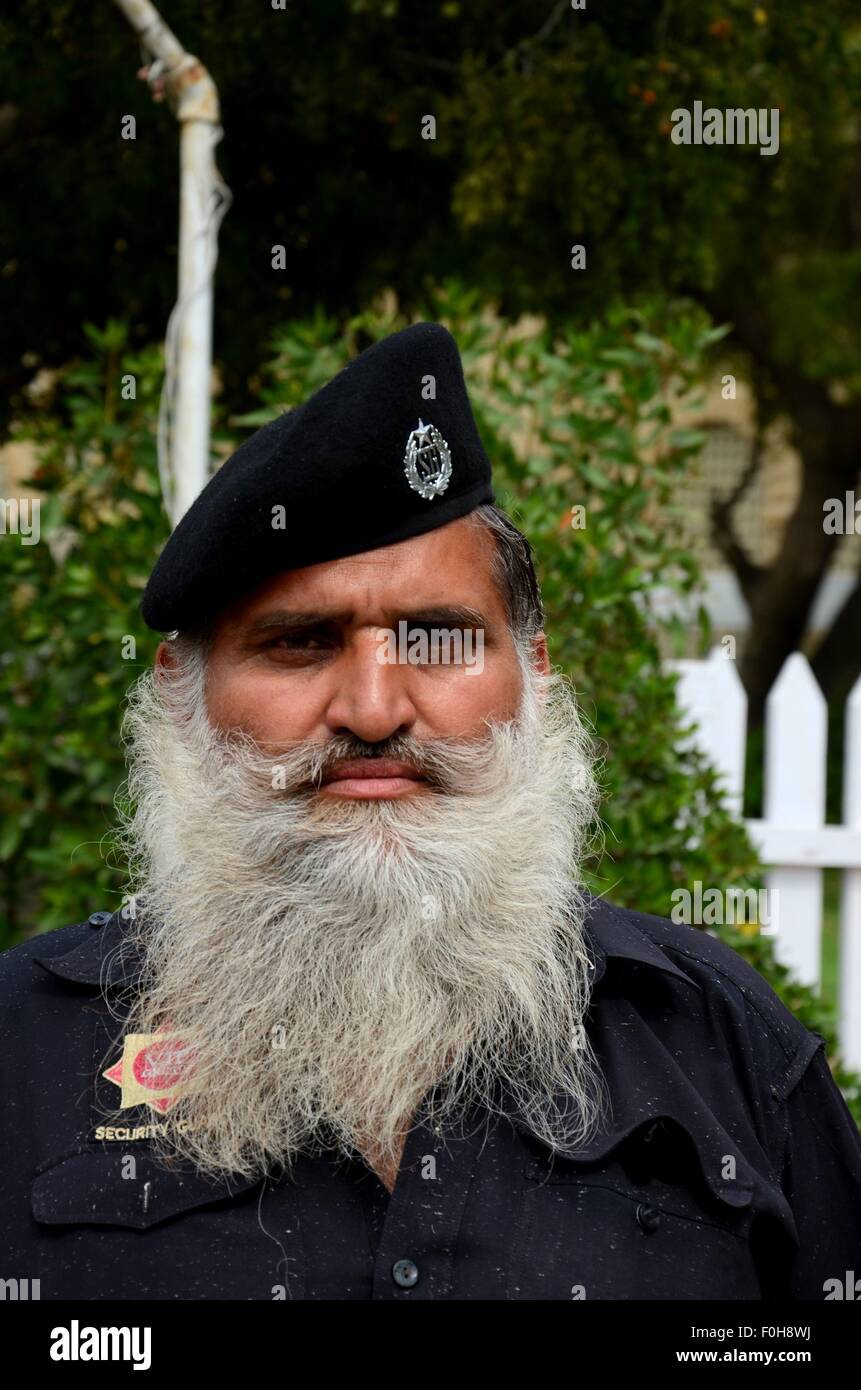 Portrait of Pakistani security guard with flowing white beard Karachi