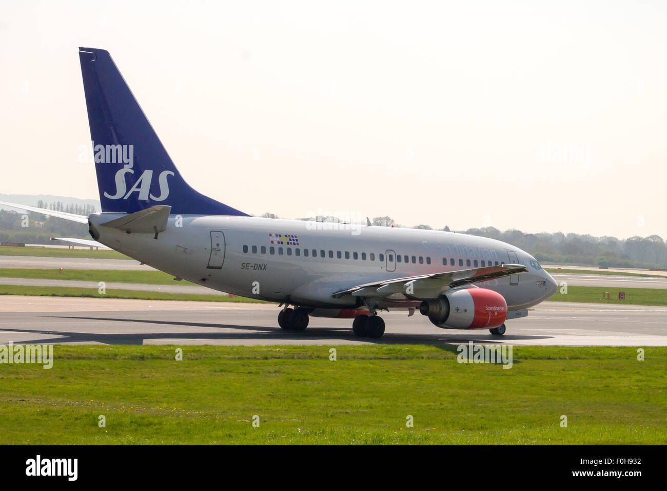 Scandinavian Airlines Boeing 737 (SE-DNX) taxiing on Manchester Airport. Stock Photo