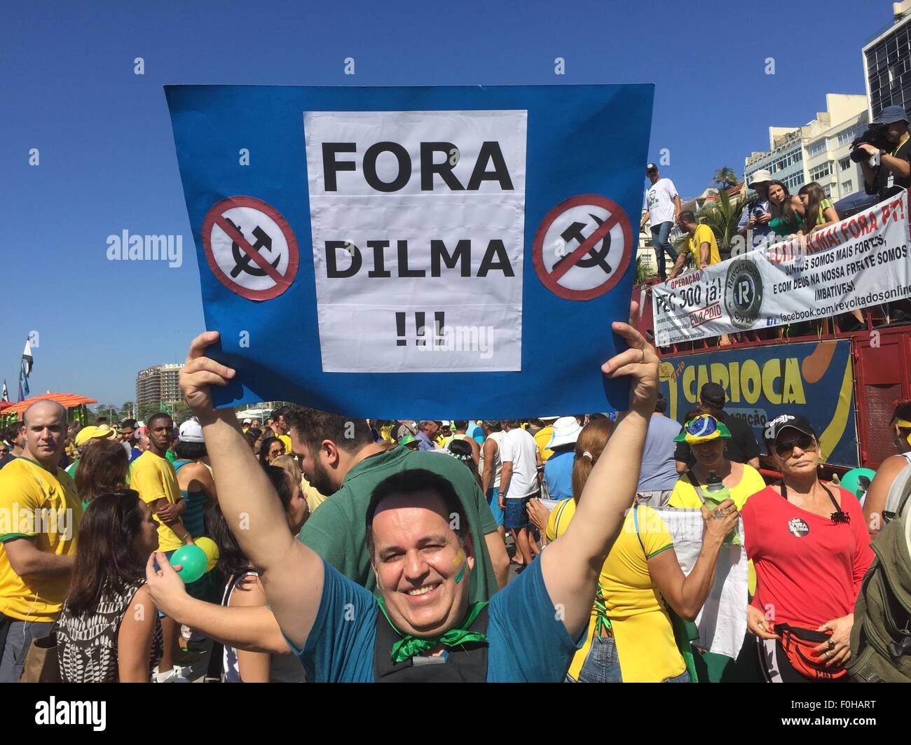 A protestor against president Rousseff holds a placard that reads 'Fora Dilma' (Dilma out) at a demonstration in Rio de Janeiro, Brazil, 16 August 2015. Many Brazilians are calling for Rousseff's resignation due to an extensive corruption scandal. PHOTO: GEORG ISMAR Stock Photo