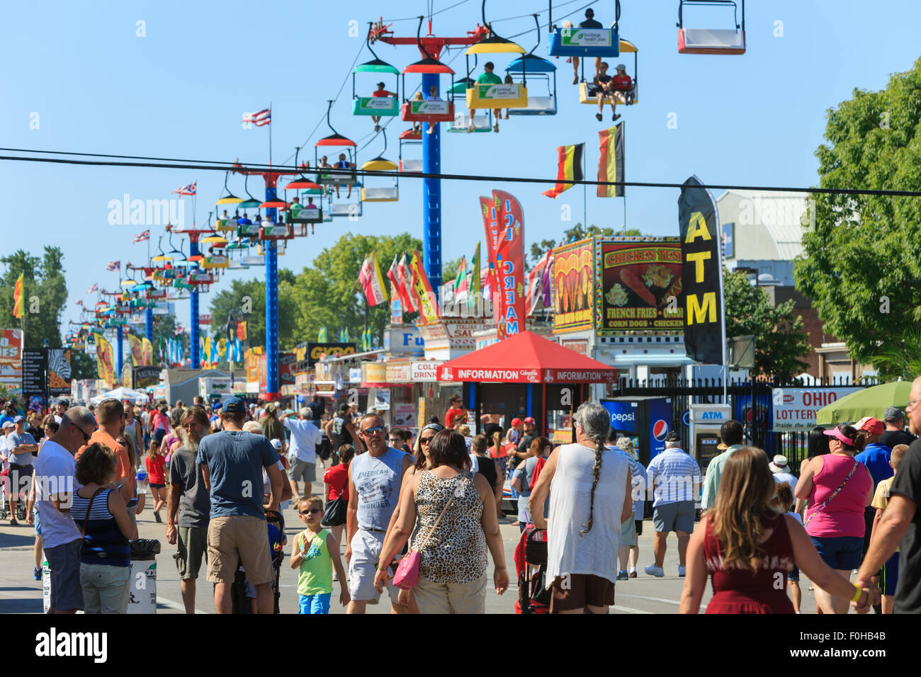A large crowd walks on the midway at the Ohio State Fair in Columbus, Ohio. Stock Photo