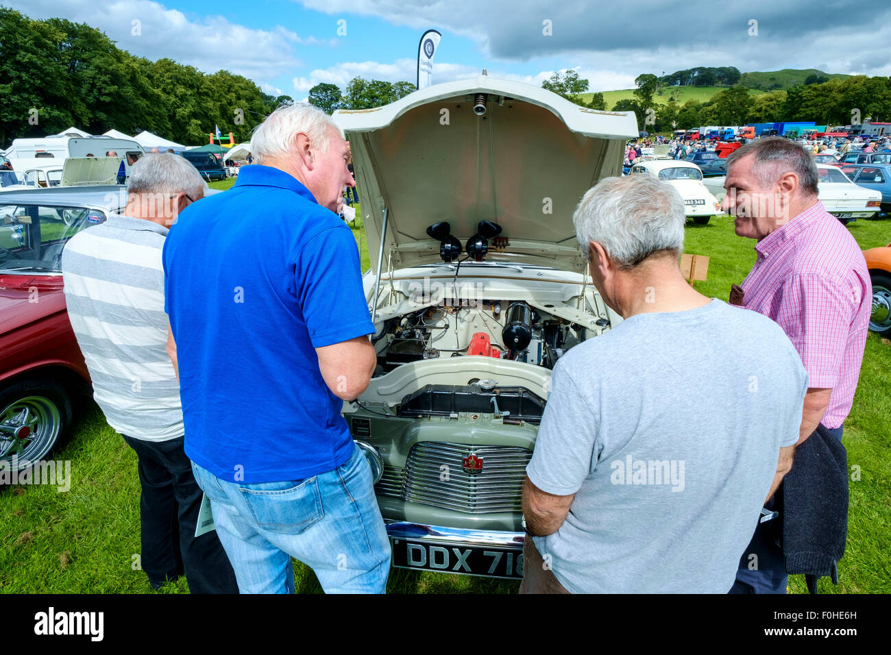 Men admiring a car at the Biggar Vintage Rally, South Lanarkshire