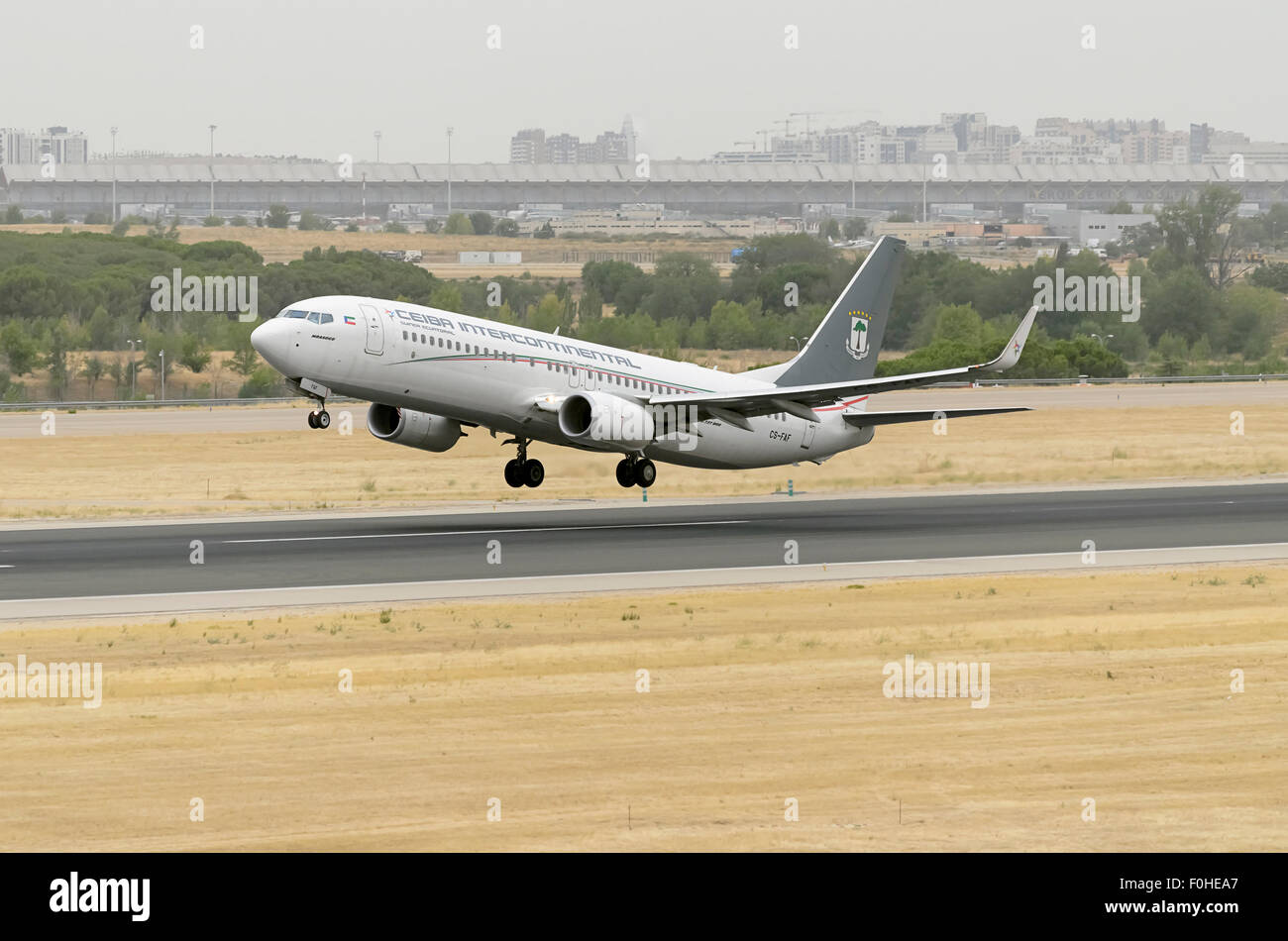 Aircraft -Boeing 737-8FB-, of -Ceiba Intercontinental- airline, is taking off from Madrid-Barajas -Adolfo Suarez- airport. Stock Photo