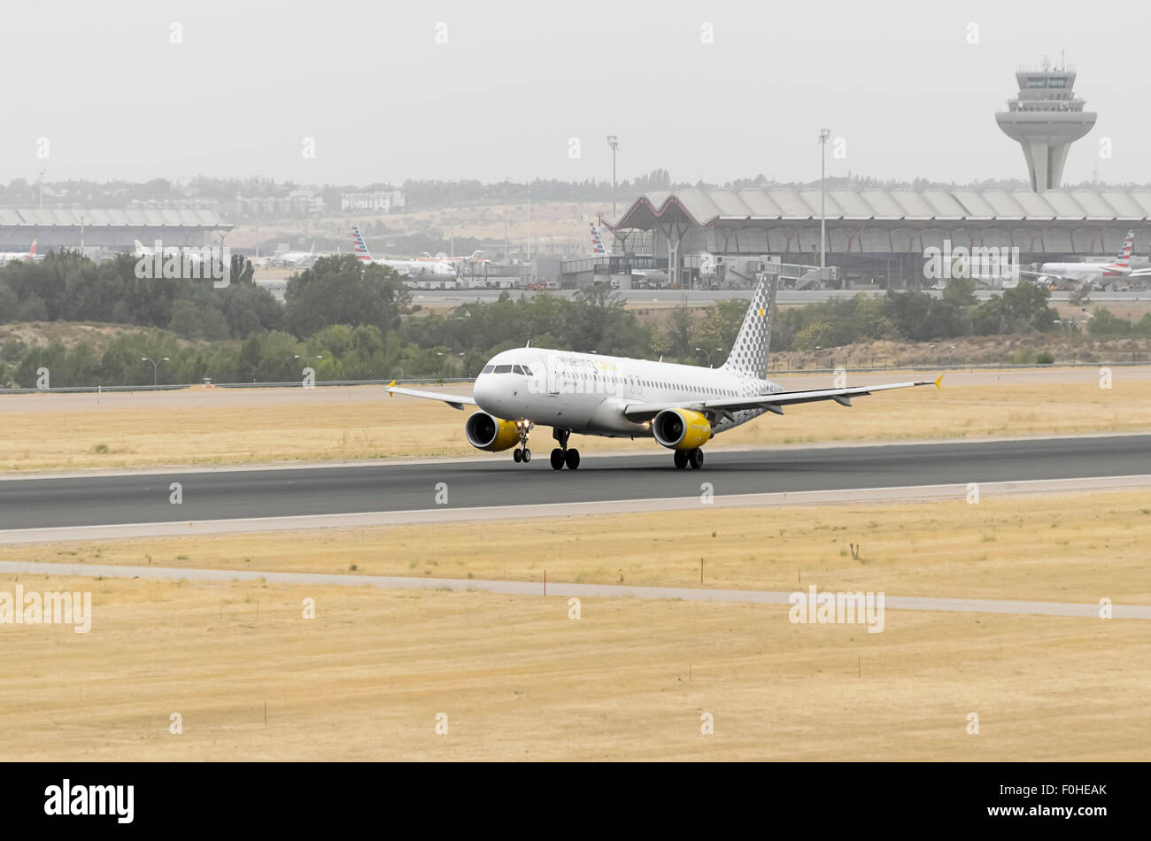 Aircraft -Airbus A320-214-, of -Vueling- airline, is taking off from Madrid-Barajas -Adolfo Suarez- airport. Stock Photo