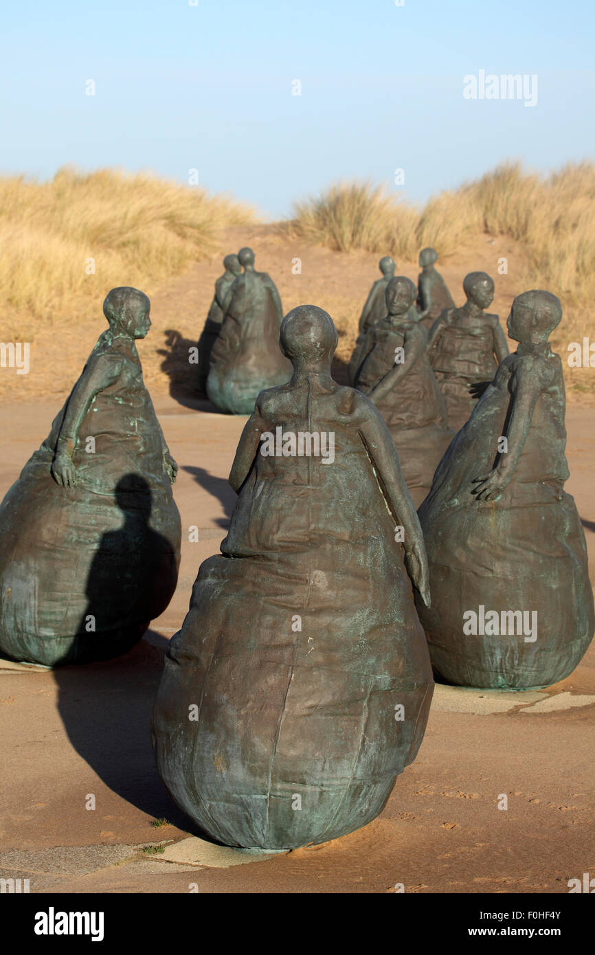 Conversation Piece by Juan Munoz in South Shields, England. The sculptures stand by Littlehaven Beach. Stock Photo