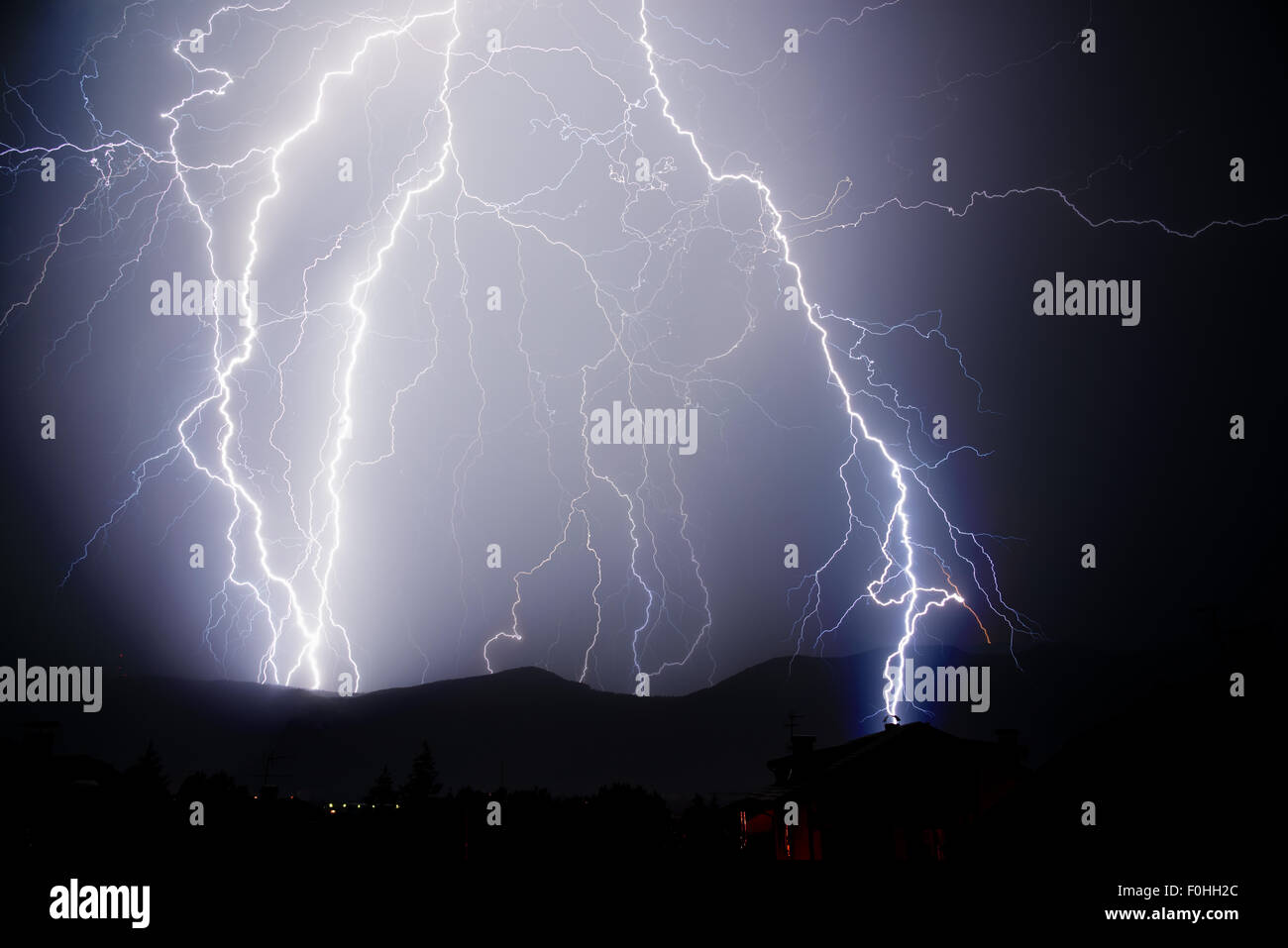 Thunderstorm with lightnings in a dark thunderous night Stock Photo