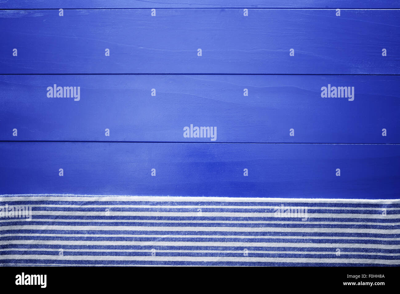 Blank blue wooden boards with napkin aligned horizontally Stock Photo