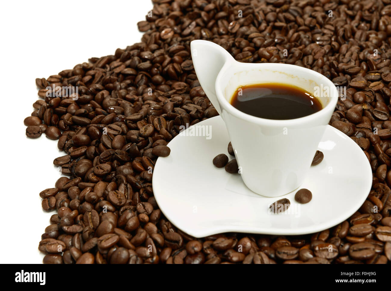 Cup of espresso coffee on beans Stock Photo Alamy