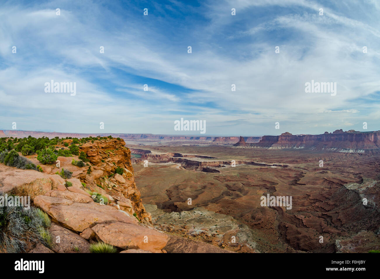 View of the Colorado River cutting through the canyon at the end of Murphy Trail in Canyonlands National Park Stock Photo