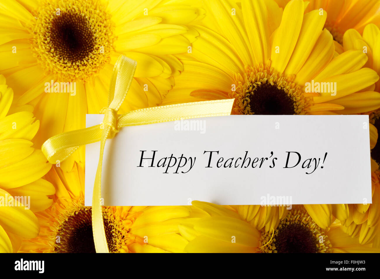 Happy Teachers Day message with yellow gerberas Stock Photo - Alamy