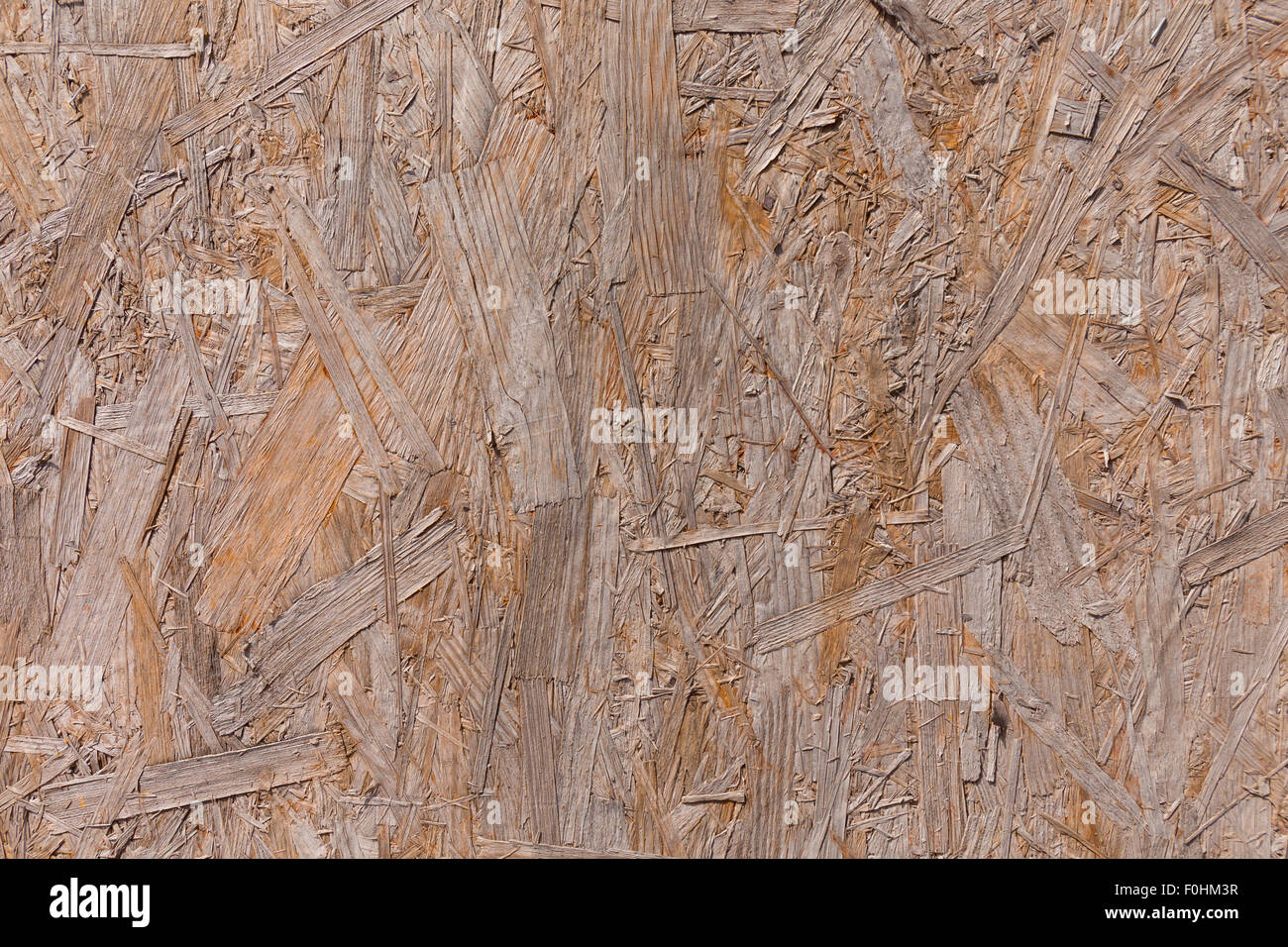 Old plywood recycled compressed wood chippings board background texture