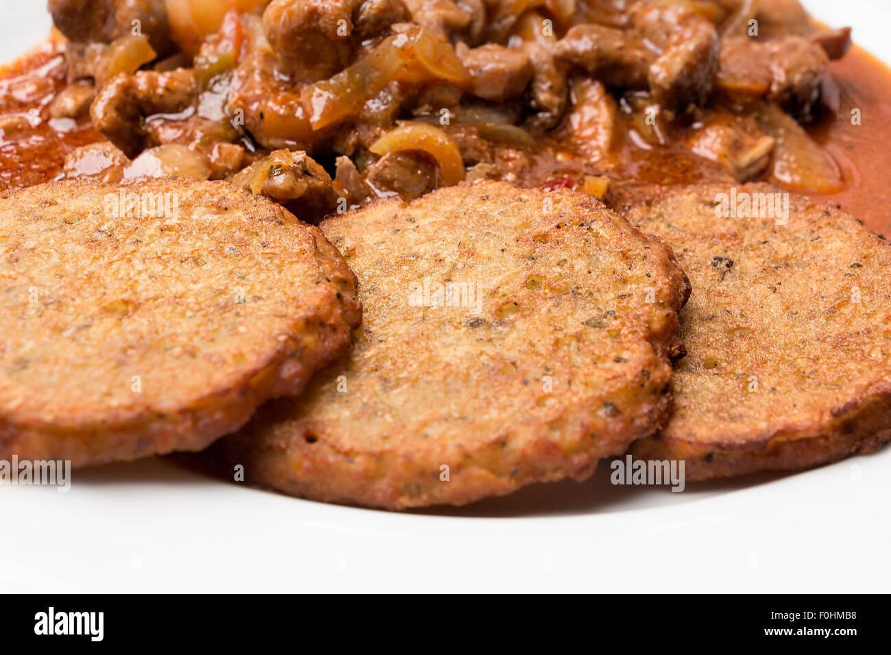 Potato pancakes with meat mixture, typical Czech or German meal or dish. Stock Photo