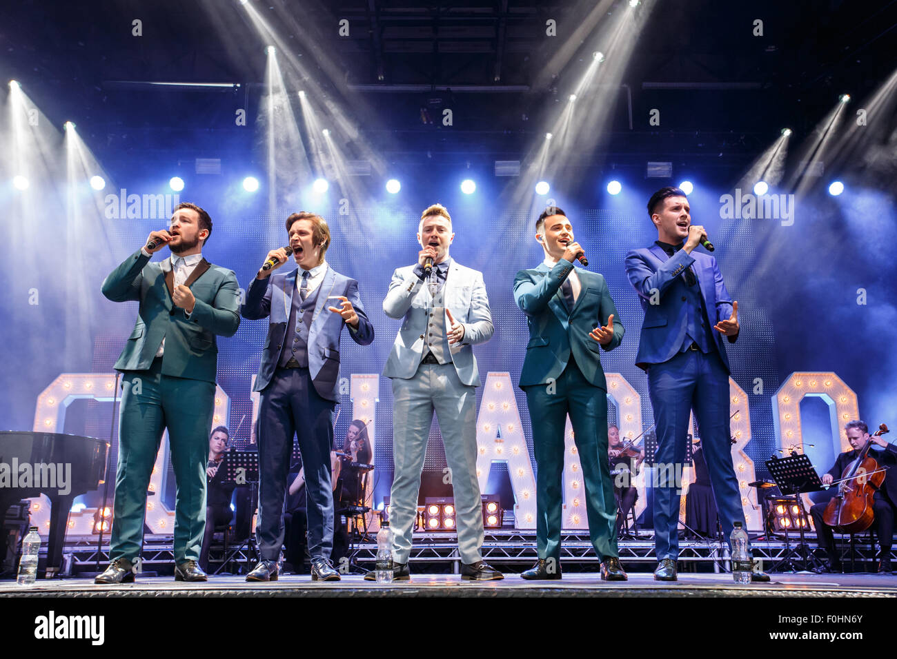 Betley, Cheshire, UK. 16th August, 2015. Collabro performs live at Betley Concerts held at Betley Court Farm, near Crewe, Cheshire. Collabro members Richard Hadfield, Thomas Redgrave, Matt Pagan, Michael Auger and Jamie Lambert entertain the crowd. Credit:  Simon Newbury/Alamy Live News Stock Photo