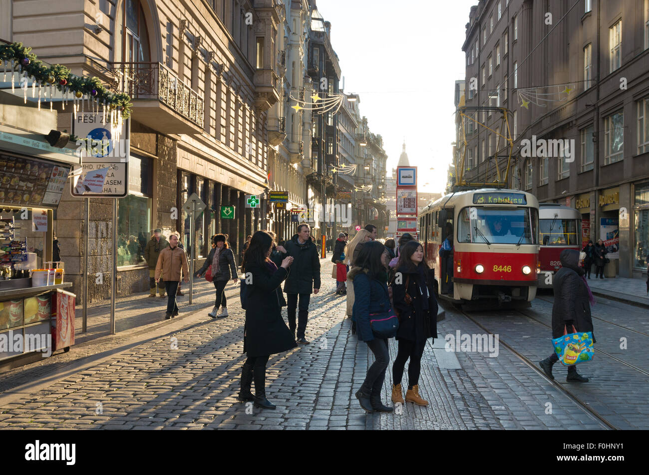 Unknown people in the streets of Prague with a typical tram or cable car in the background Stock Photo