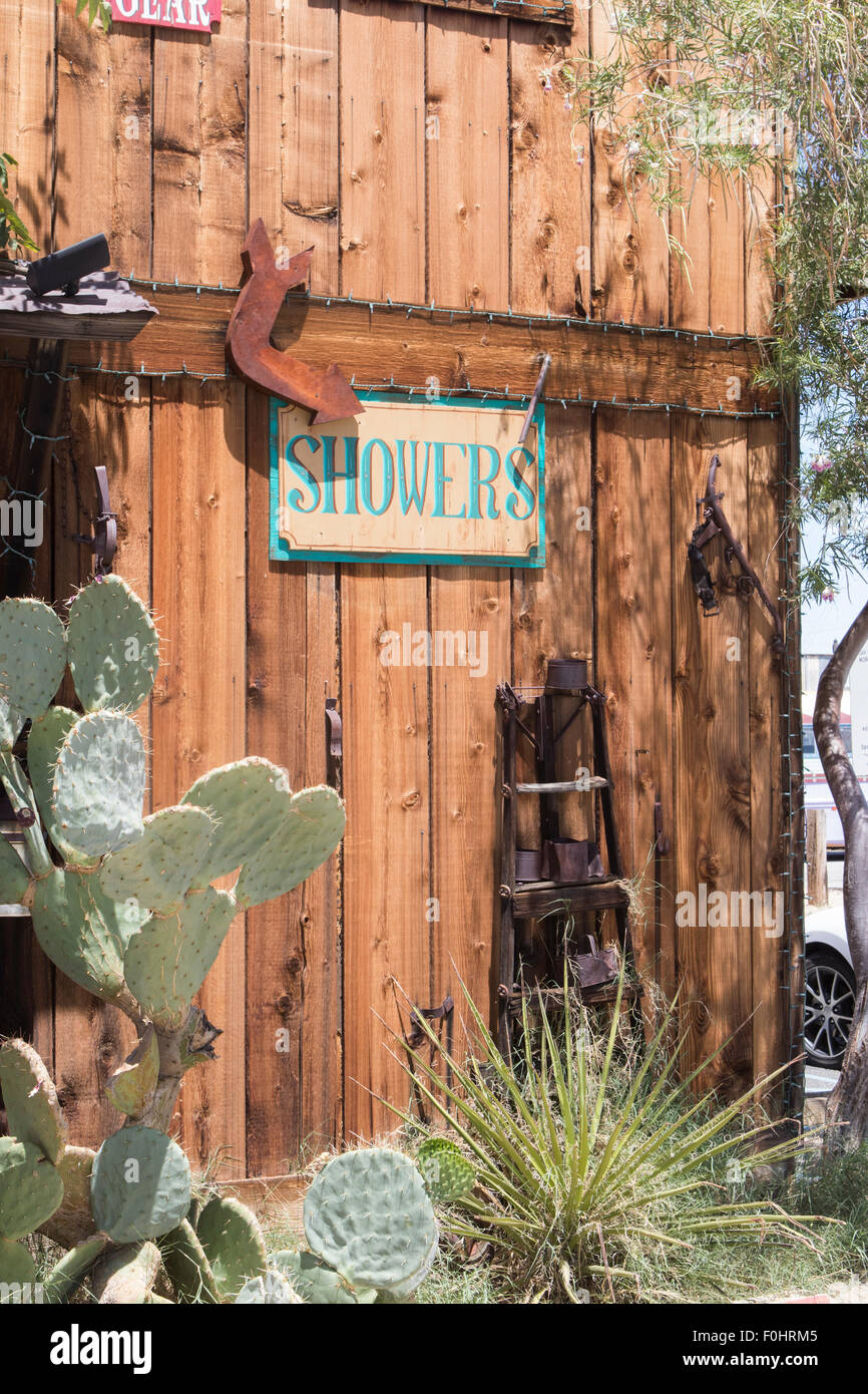Wooded public showers sign in the Mojave desert town of Joshua Tree