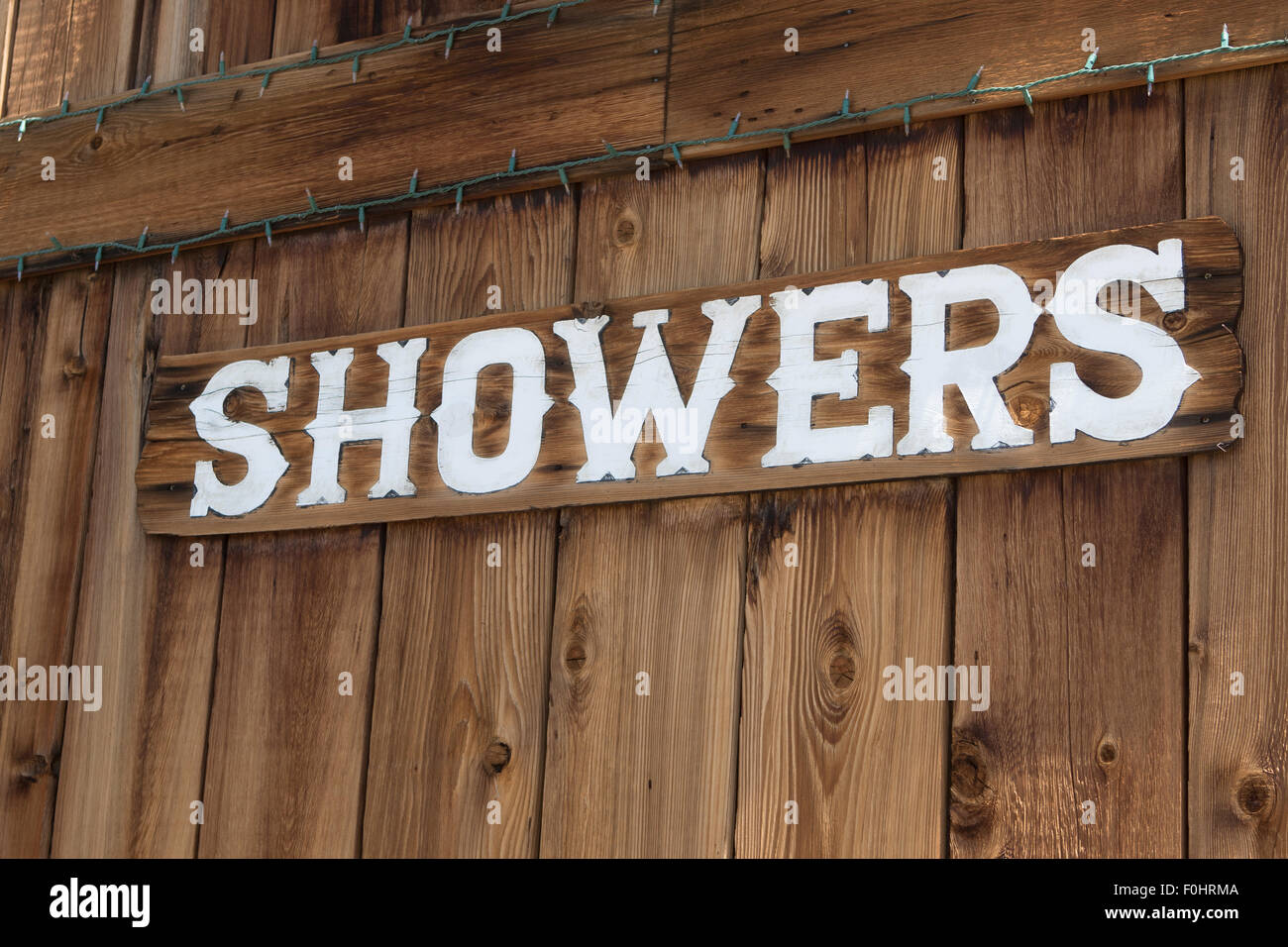 Wooded public showers sign in the Mojave desert town of Joshua Tree