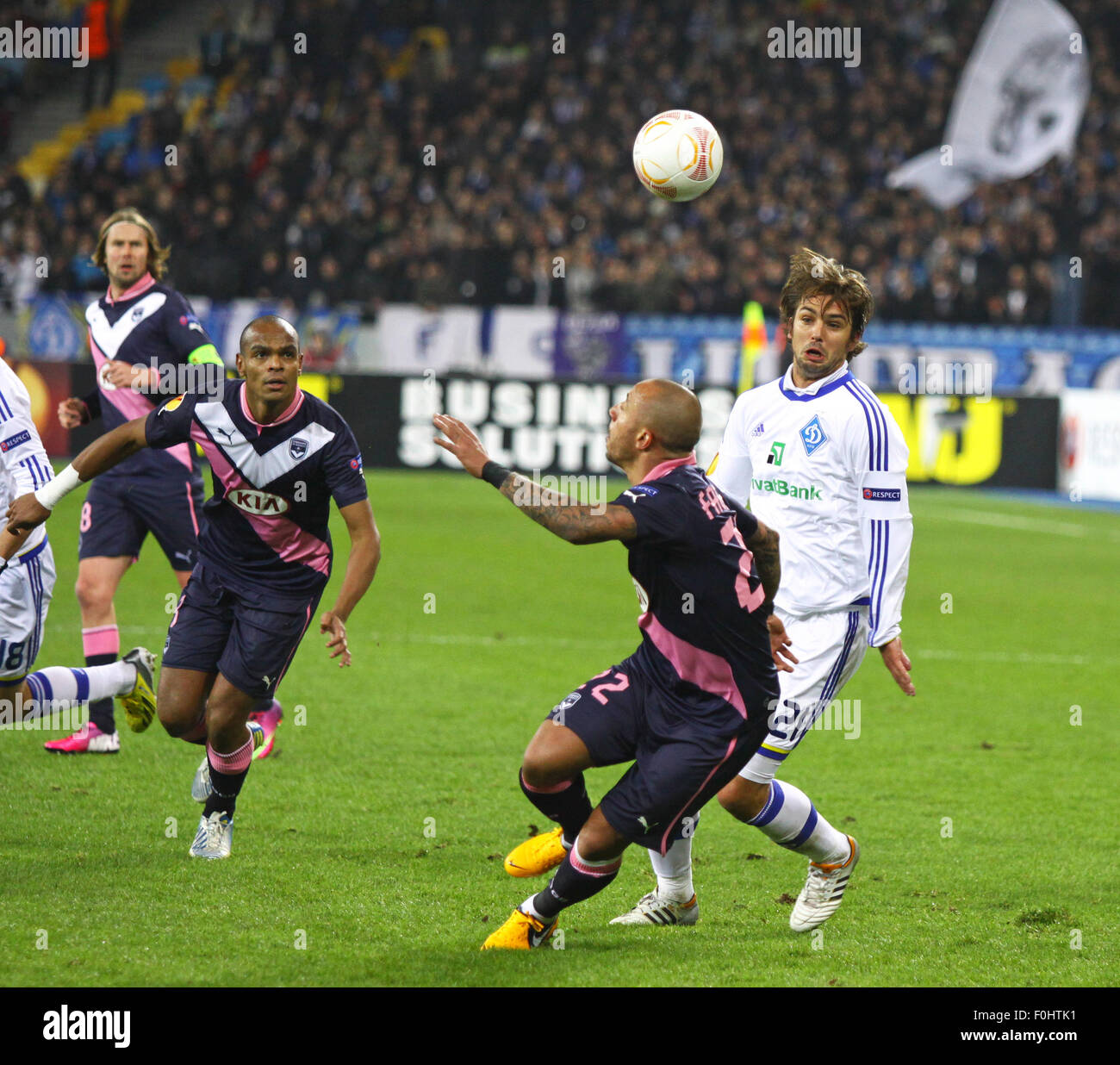 KYIV, UKRAINE - FEBRUARY 14, 2013: Niko Kranjcar of FC Dynamo Kyiv (in White) fights for the ball with Julien Faubert of FC Girondins de Bordeaux during their UEFA Europa League game on February 14, 2013 in Kyiv, Ukraine Stock Photo