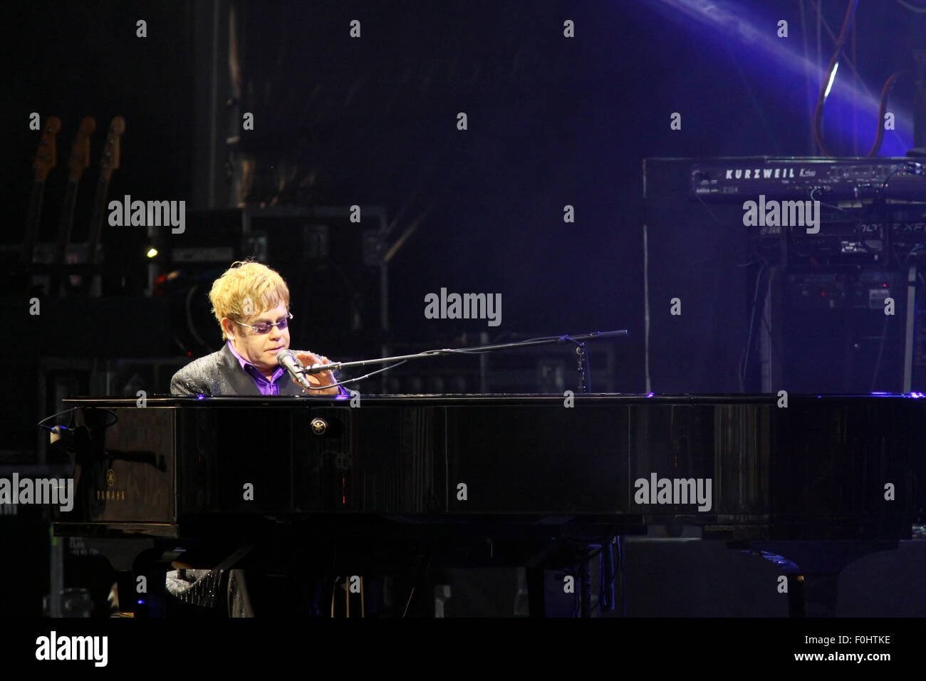 KYIV, UKRAINE - JUNE 30, 2012: Singer Sir Elton John performs onstage during charity Anti-AIDS concert at the Independence Square on June 30, 2012 in Kyiv, Ukraine Stock Photo