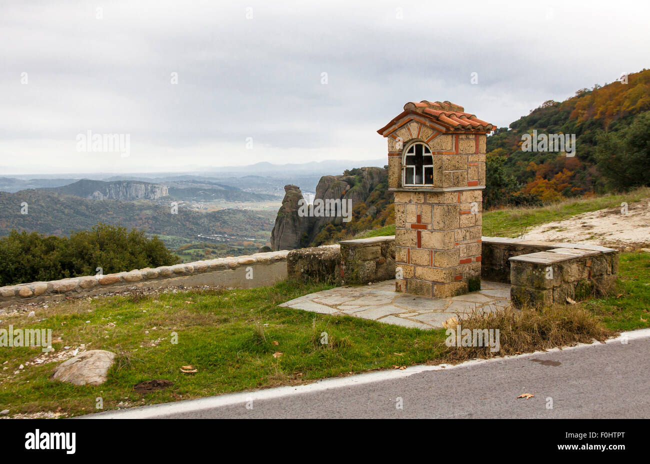 Typical greek small road shrine on the road of Meteora mountains, Trikala region, Greece Stock Photo
