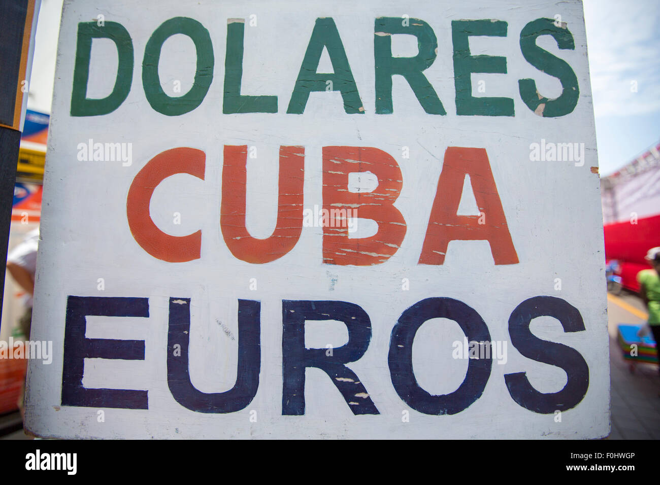 Close-up of a signboard in the street of Trujillo proposing money exchange services in Dollars, Euros and Cuban currency. Stock Photo