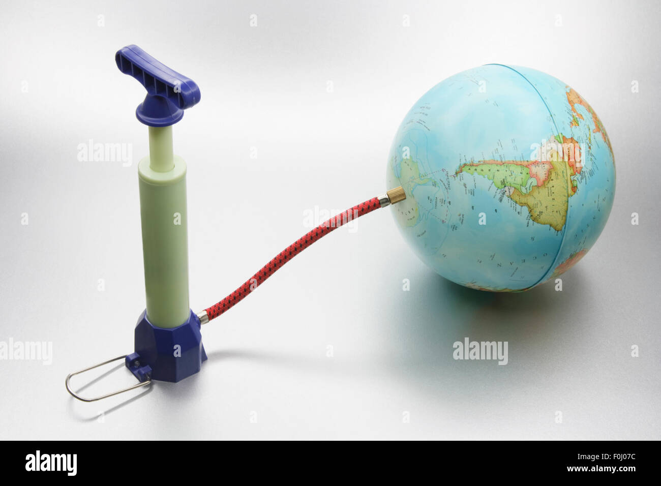 Miniature Pump Attached to Globe Stock Photo