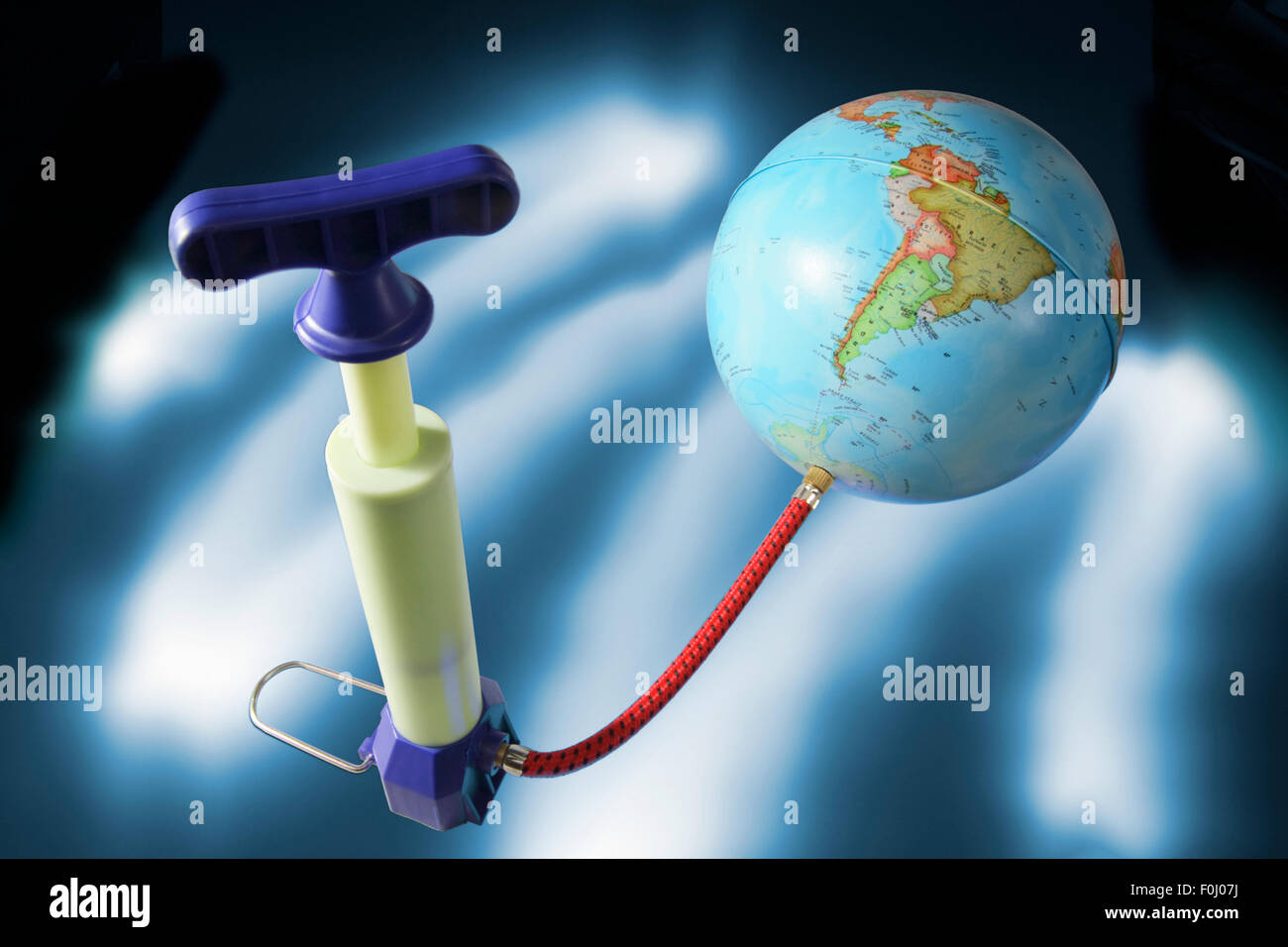 Miniature Pump Attached to Globe Stock Photo